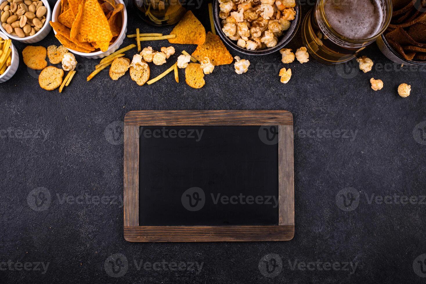 Beer and different snacks for Superbowl or football party photo