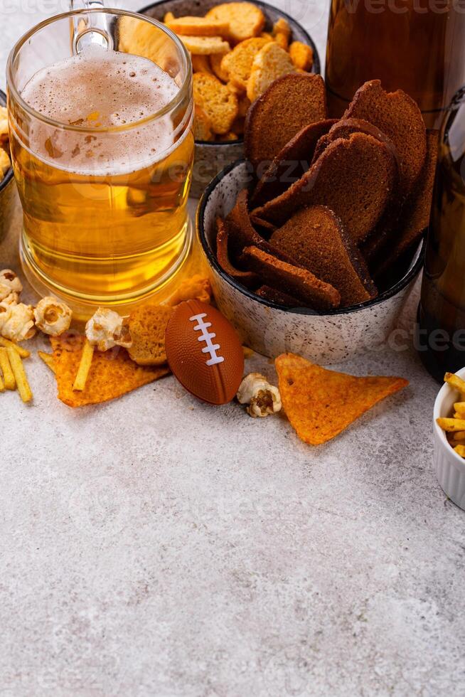 Beer and different snacks for Superbowl or football party photo