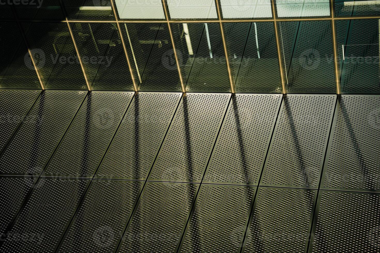 A window with a reflection of a clock photo