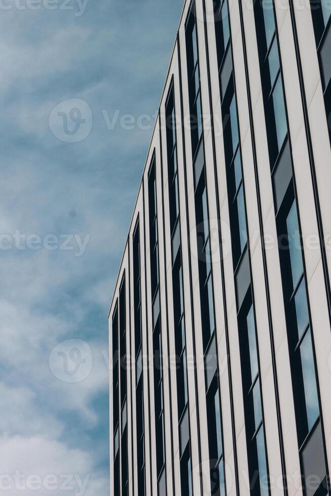 A building with windows and a sky background photo
