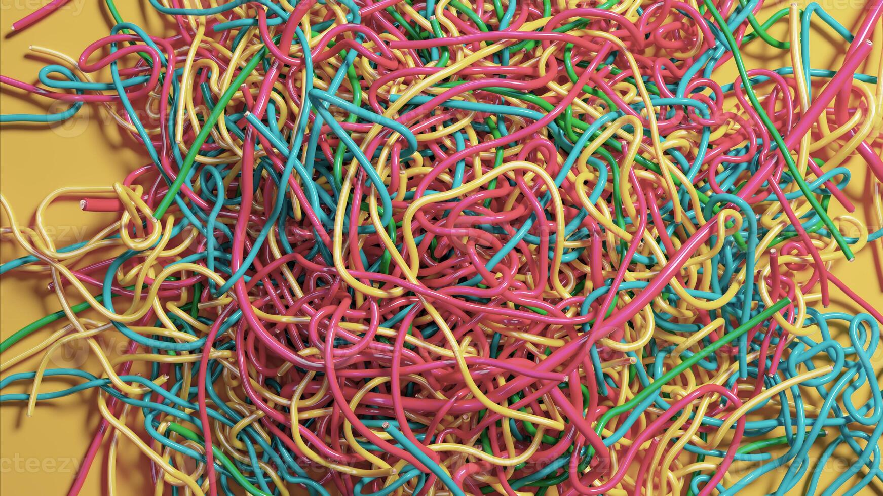 Vibrant Tangle of Colorful Wires Against a Bright Yellow Backdrop photo