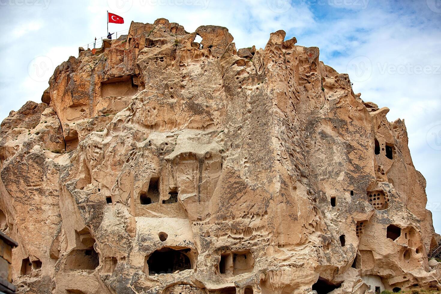 Exploring the ancient rock formations and cave dwellings in Cappadocia at dusk photo