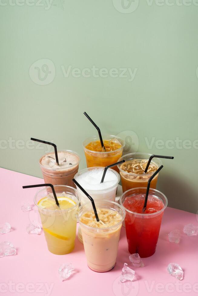 Summer drinks with ice and straws. Lemonade and coctails photo
