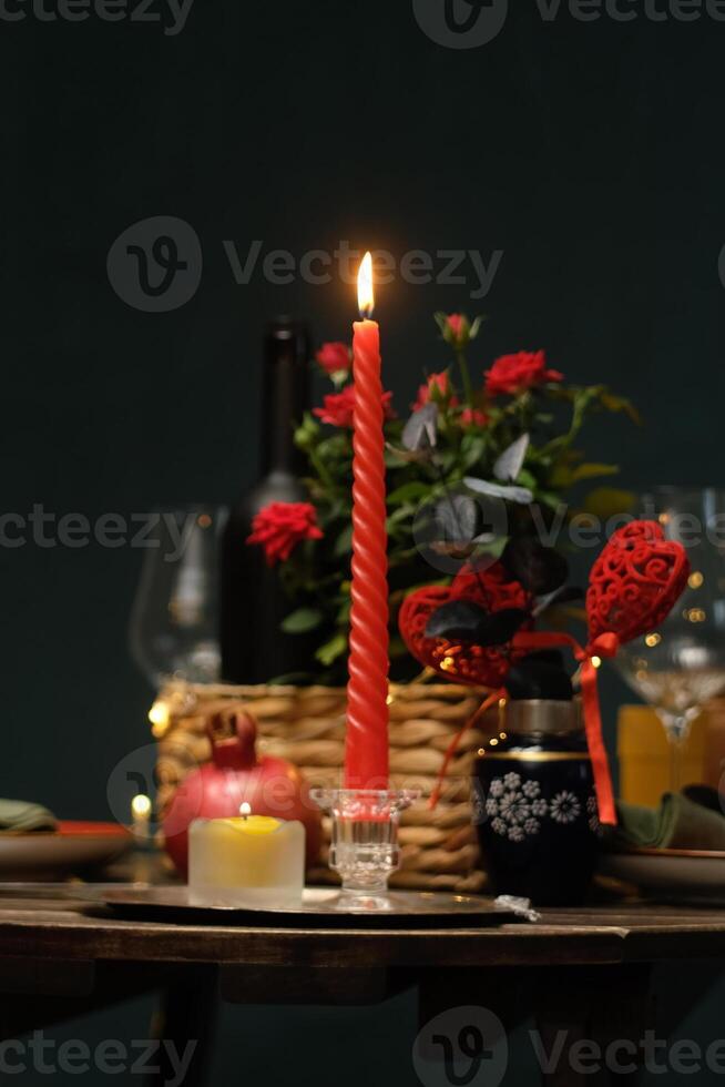 Candlelit dinner for two. Table is set for Valentines day celebration. Romantic date concept. photo