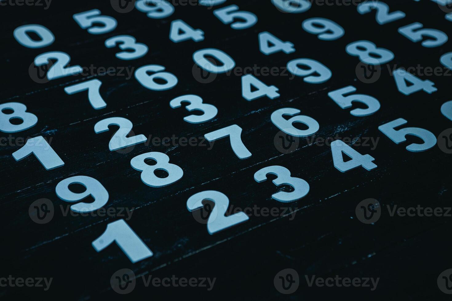 Numbers on a dark background, close-up, computer generated images photo