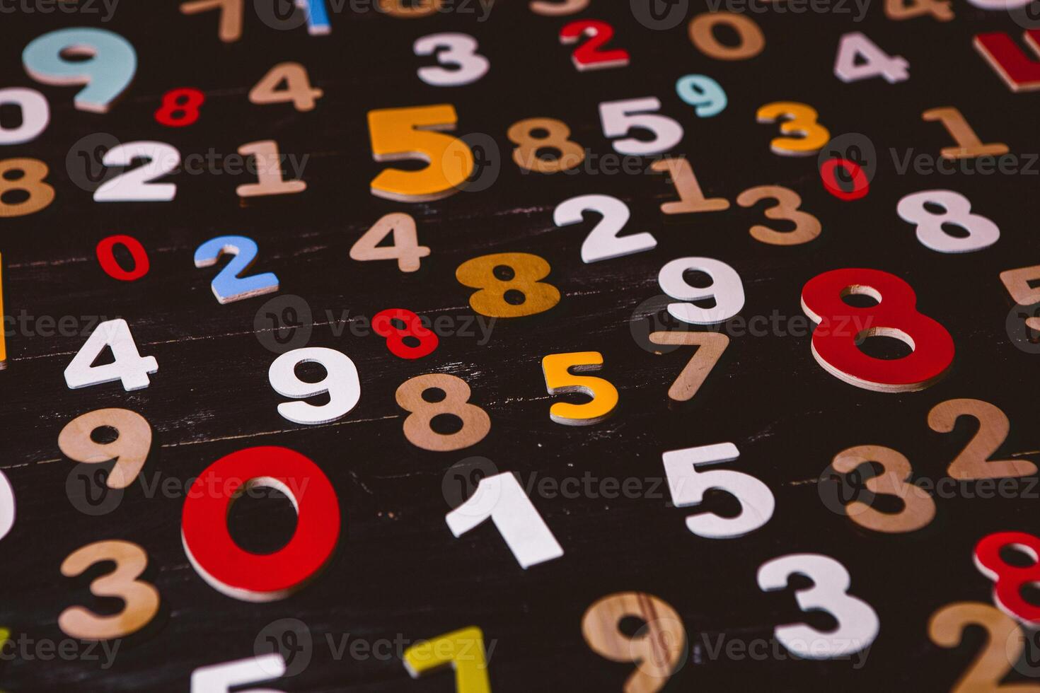 Numbers on a black wooden background. The concept of the number. photo