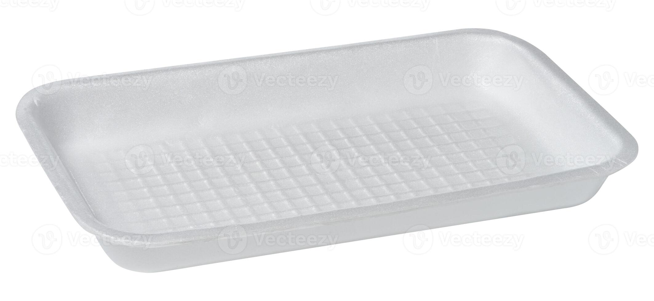 White disposable polystyrene foam rectangular plate for packaging vegetables and meat on a white isolated background photo
