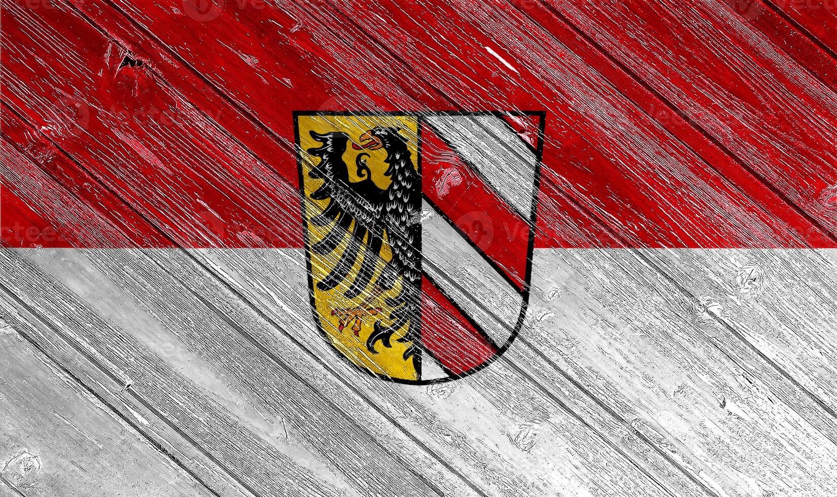 Conceptual collage of the flag of the German Bavarian city of Nuremberg on a wood texture photo