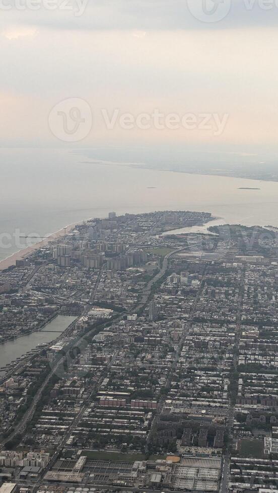 View of New York from an airplane. Haze. Vertical photo