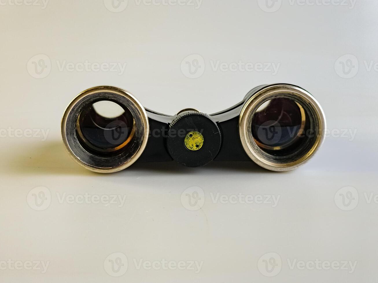 Vintage Soviet theater binoculars on a white background. Old Soviet theater binoculars. Rear view photo