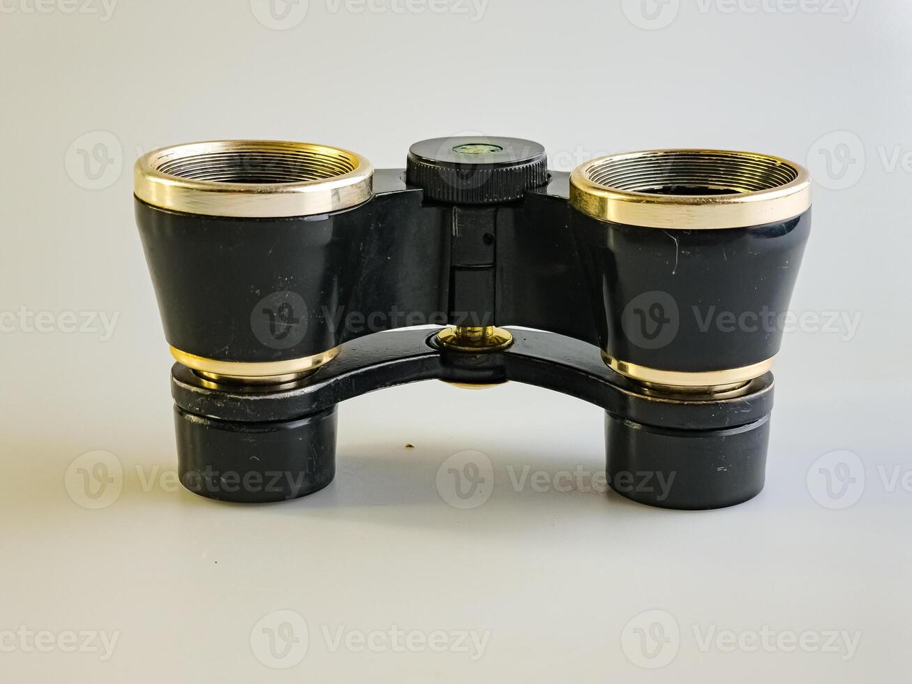 Vintage Soviet theater binoculars on a white background. An accessory for theater lovers. Old Soviet theater binoculars. Side view. photo