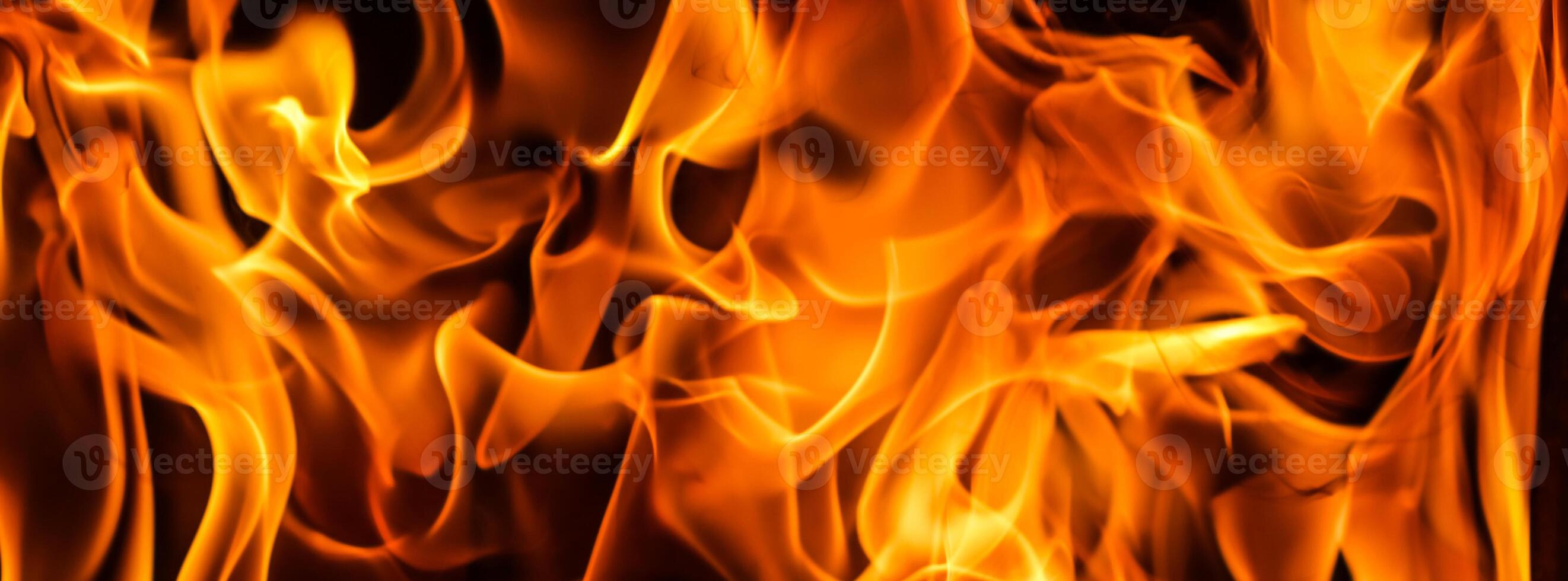 Flames of fire on a black background. The mystery of fire. photo