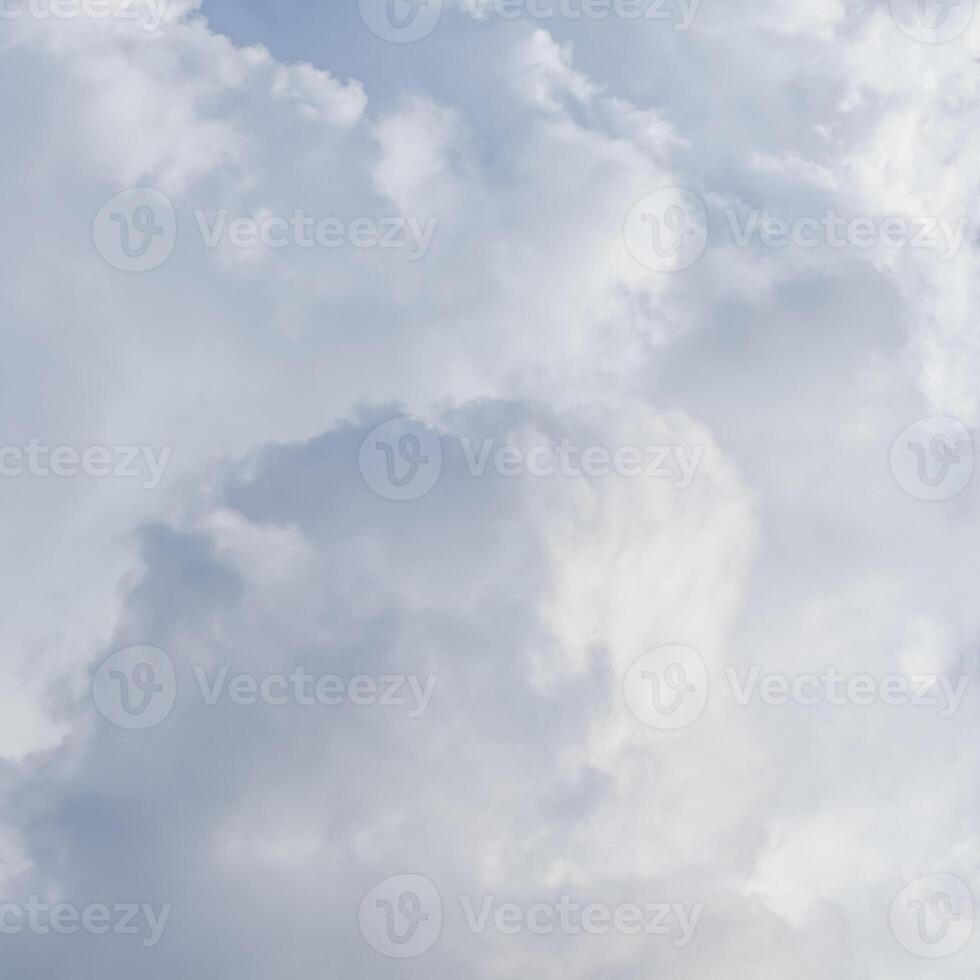 Cloudy sky background. Sunlight shining through white clouds. photo