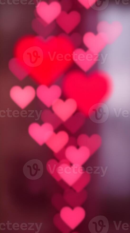 Falling hearts bokeh background. Many blurry pink hearts cascade down in a romantic, dreamy design. photo
