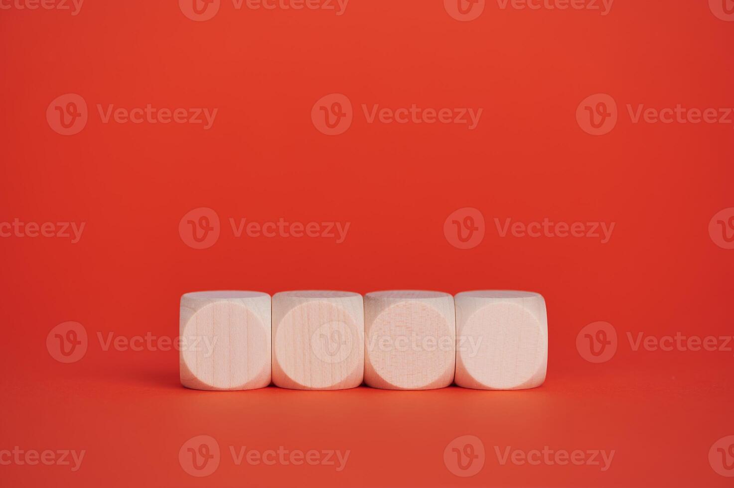 Wooden blocks on bright red background for creative text display photo