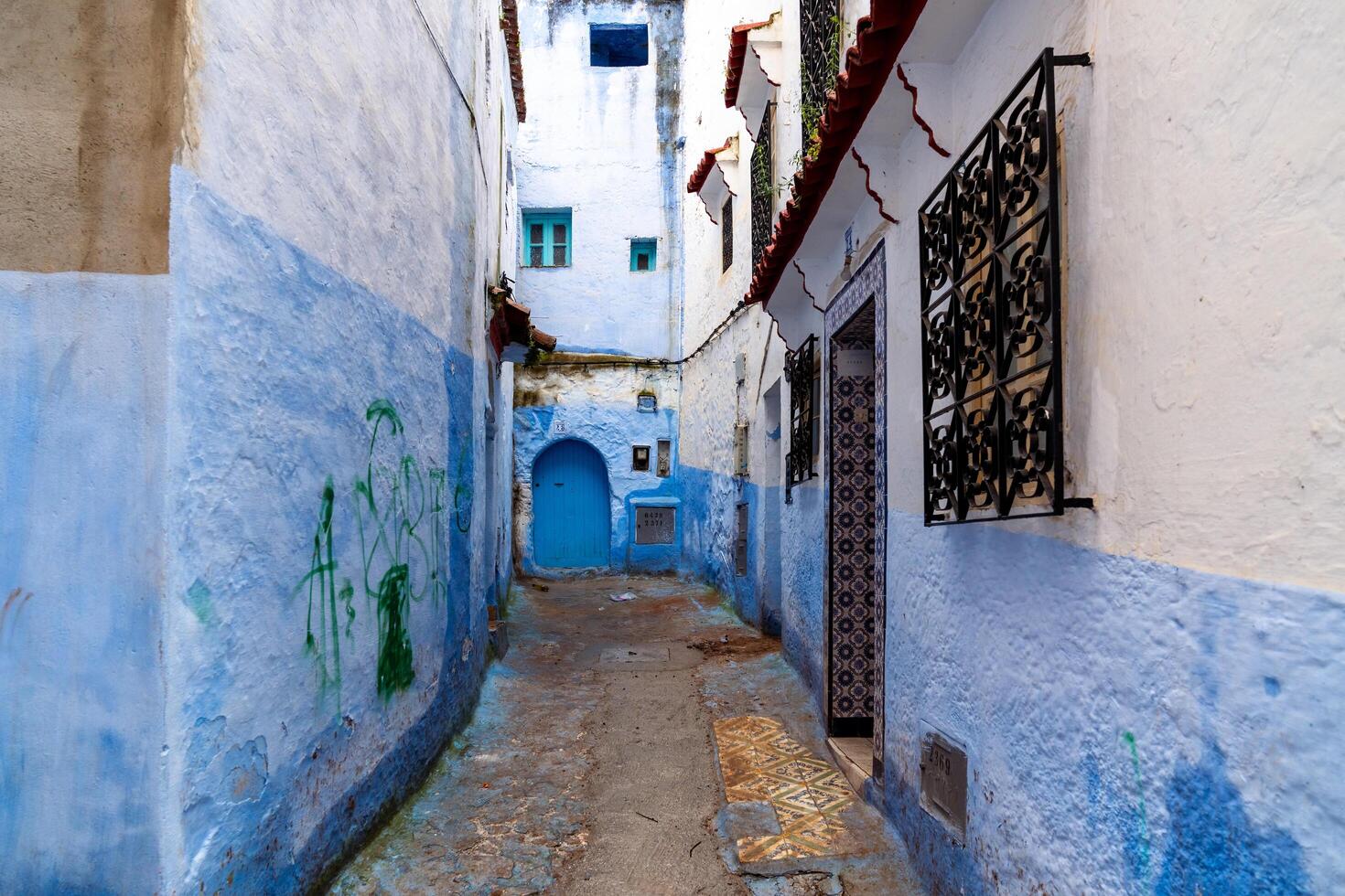 Chefchaouen, Morocco -march 26, 2024-particular of the narrow alleys in Chefchaouen the blue city during the cloudy day photo