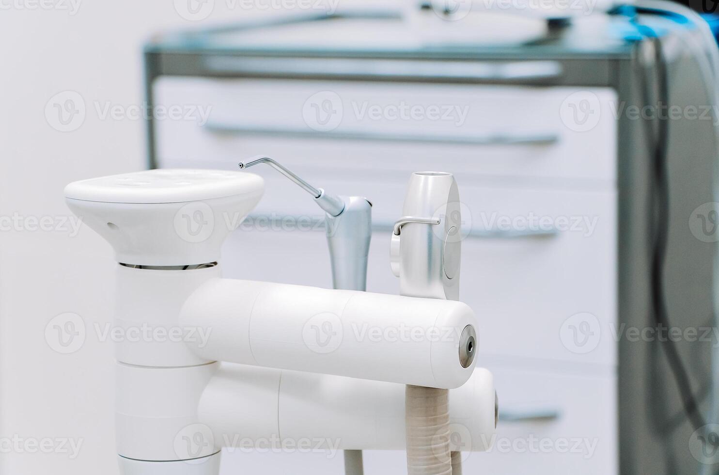 Modern dental equipment in dentist clinic. Dentists tools for treatment and surgery of teeth photo
