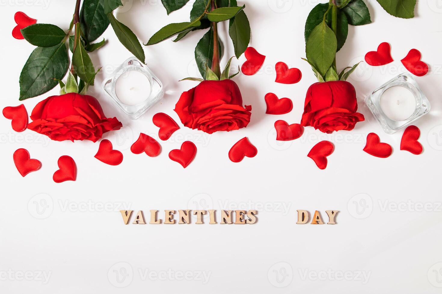 Bouquet of red roses, hearts and candles on a white background. Valentine's day February 14. Place for your text photo