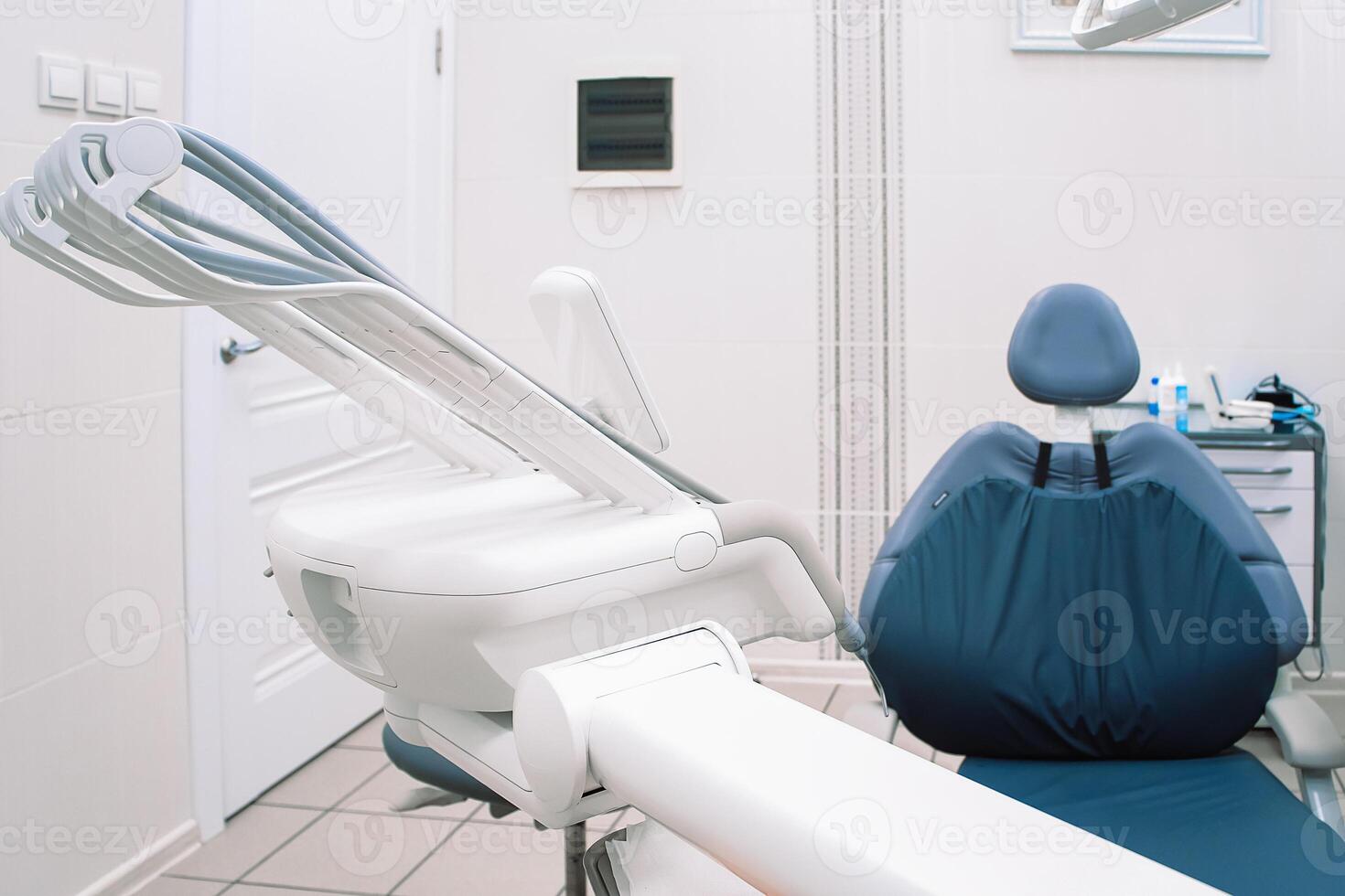 Modern dentistry clinic. Dental chair and tools for treatment and surgery of teeth. Dentist equipment photo