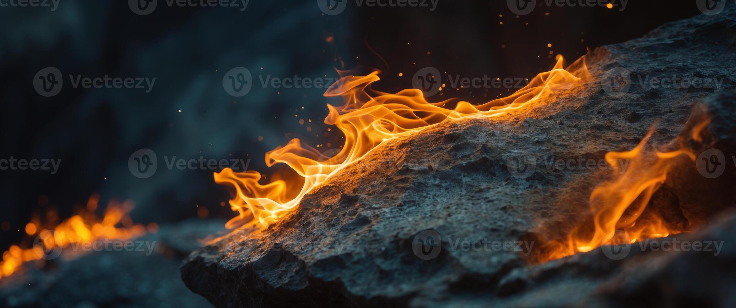 Close Up of a Rock with Fire Illuminating Its Surface Creating a Unique Geological and Fiery Scene. photo