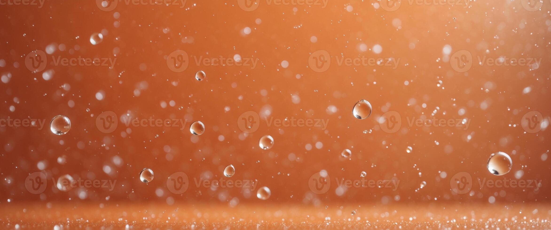 Orange background with droplets of water. photo