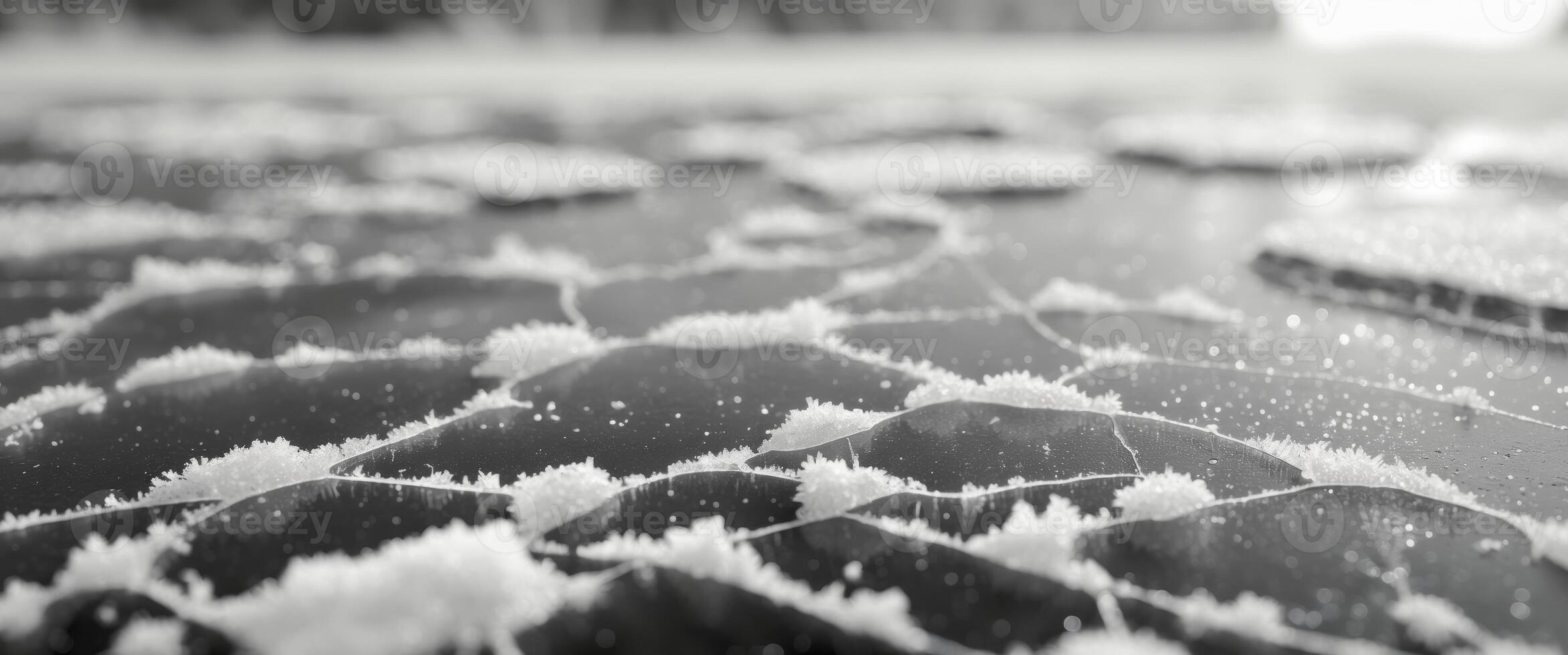 Cracked Ice Surface Texture with Snow on Edge Frozen Lake. photo