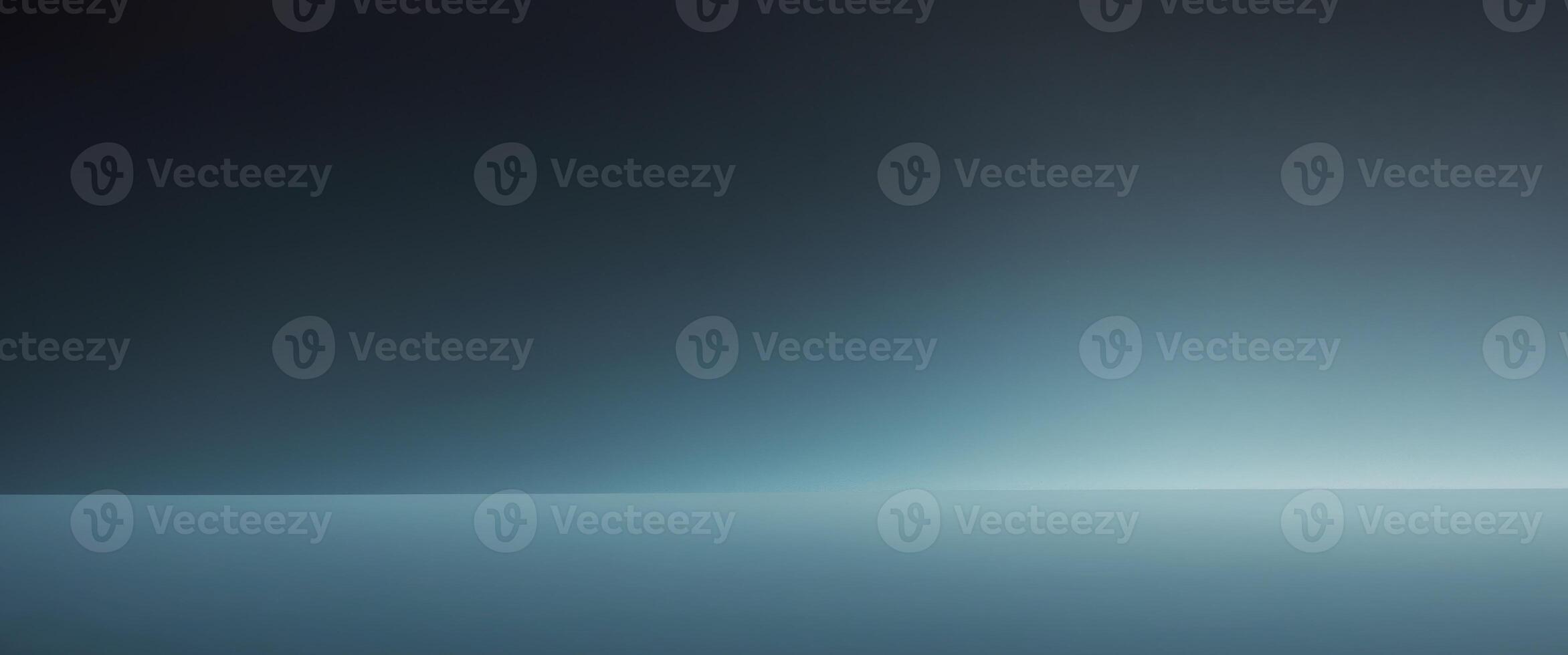 Abstract background fading from black to blue gradient. photo