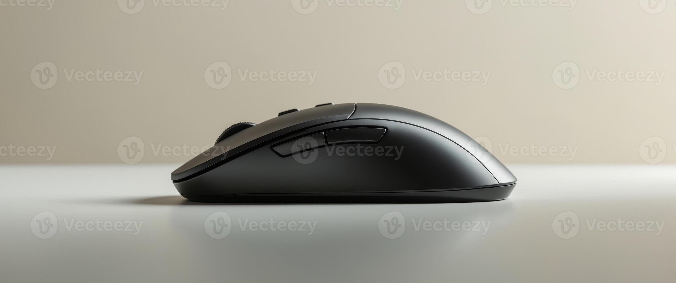 Sleek Black Wireless Computer Mouse on Desk photo