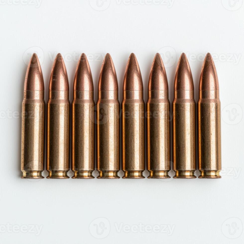 Close up of eight bullets lined up in a row photo