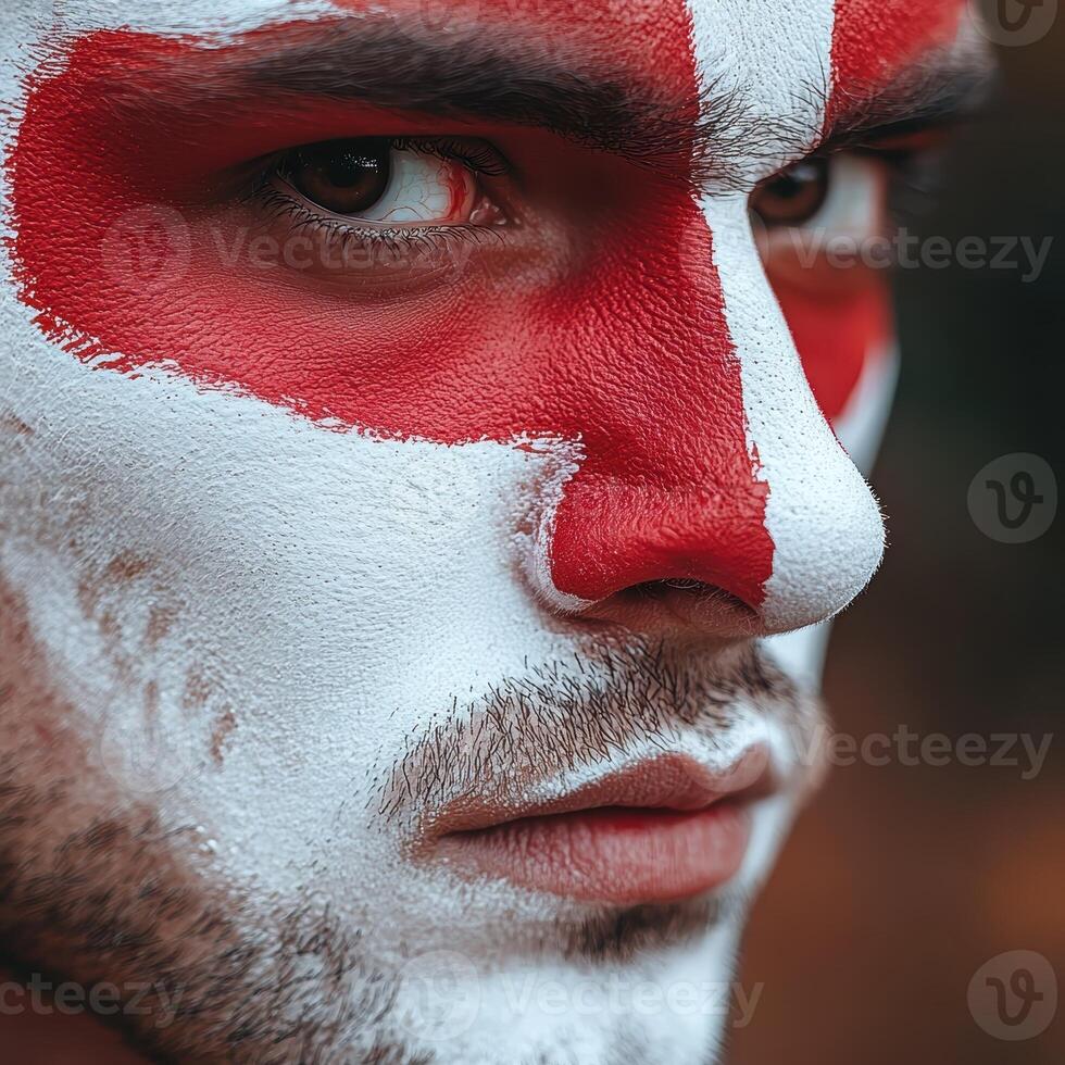 Close up portrait of a man with red and white face paint photo