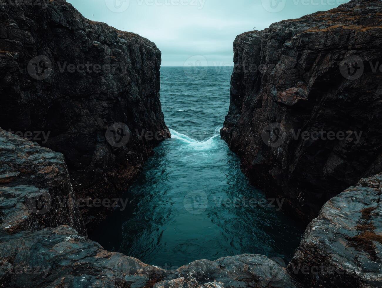 Ocean inlet between dramatic cliffs photo