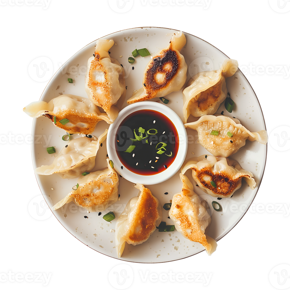A plate with dumplings and sauce on it png
