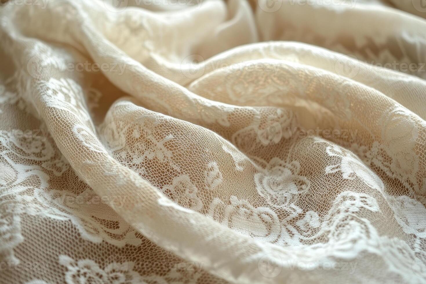 Elegant beige lace fabric with intricate floral pattern draped gracefully photo