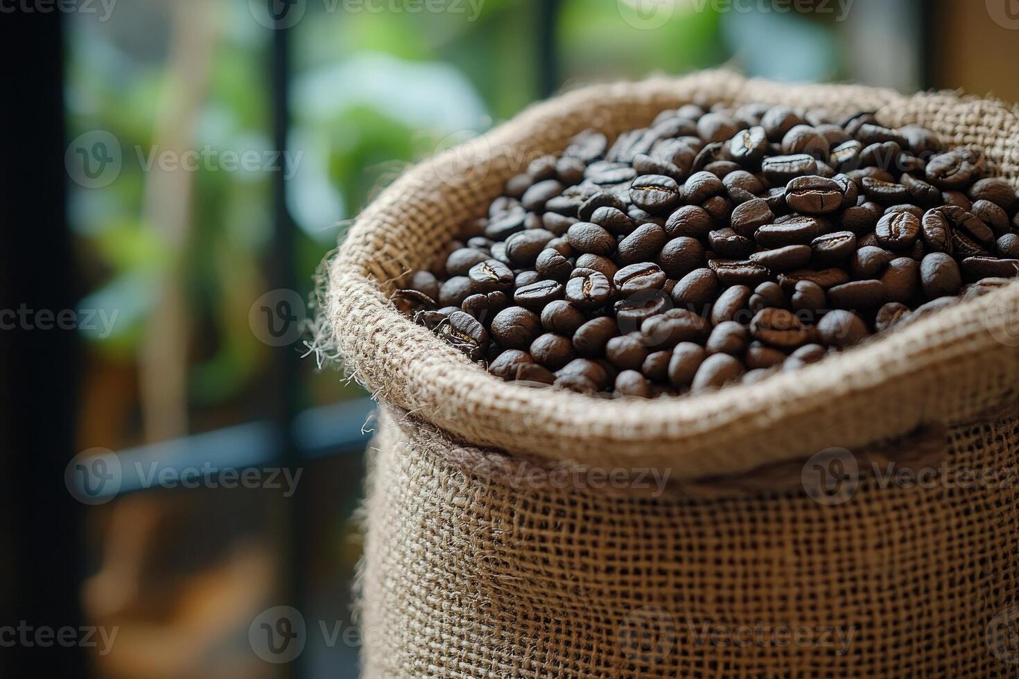 Burlap sack overflowing with fresh coffee beans photo