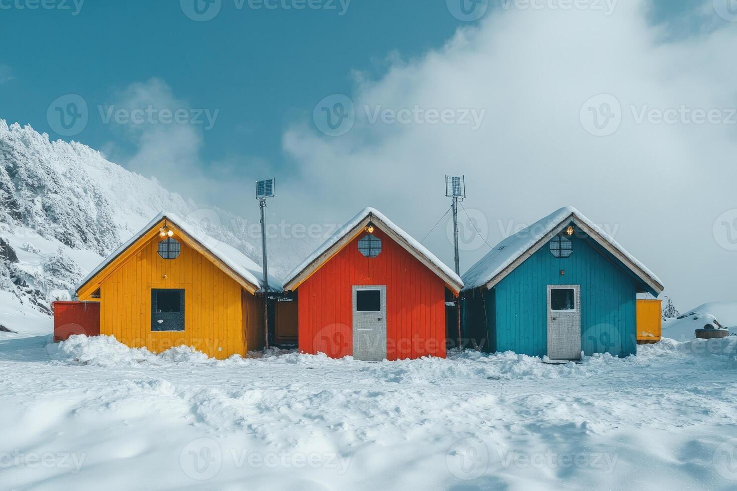 Colorful cabins in snowy mountain landscape photo