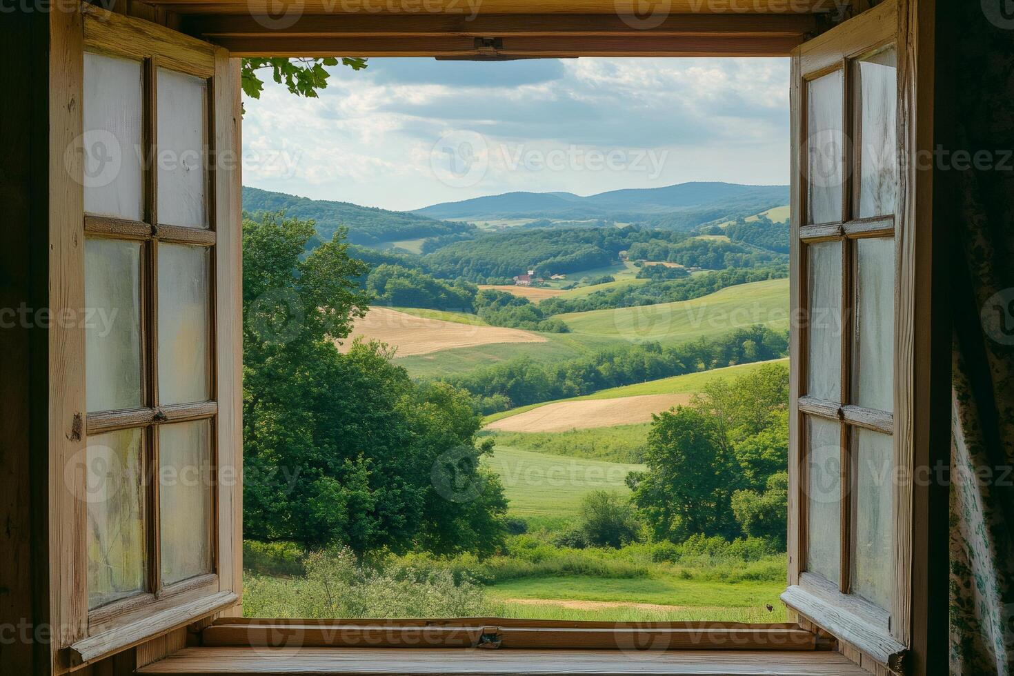 Open window overlooking idyllic rolling green hills landscape photo