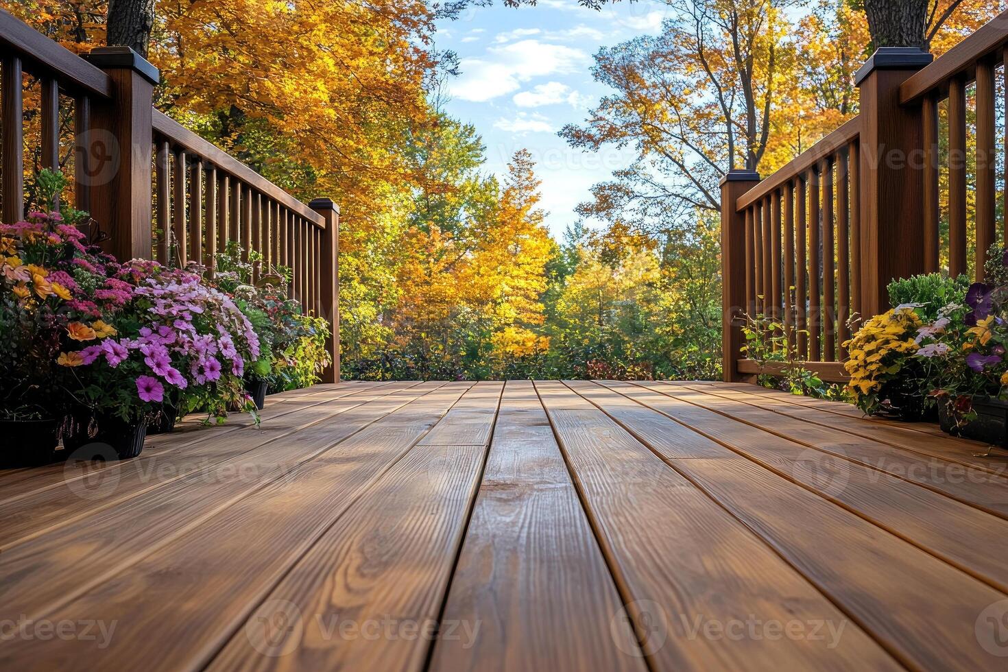 Wooden deck with railing and autumn foliage creating a relaxing ambiance photo