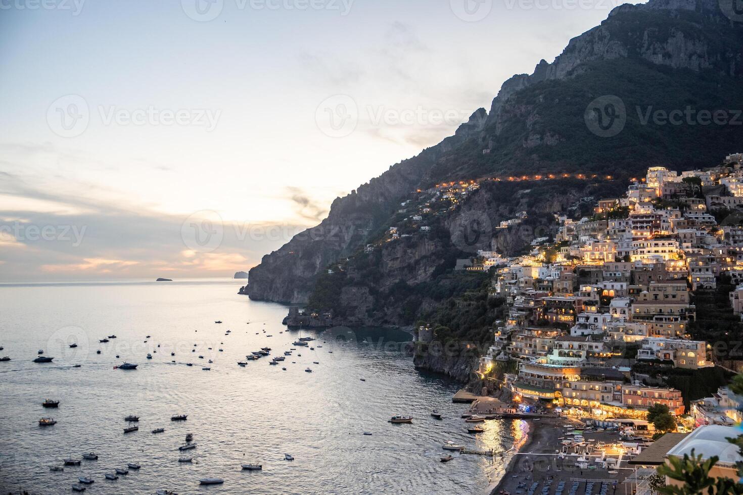 Night view over Positano town and beach in Amalfi coast in Italy photo