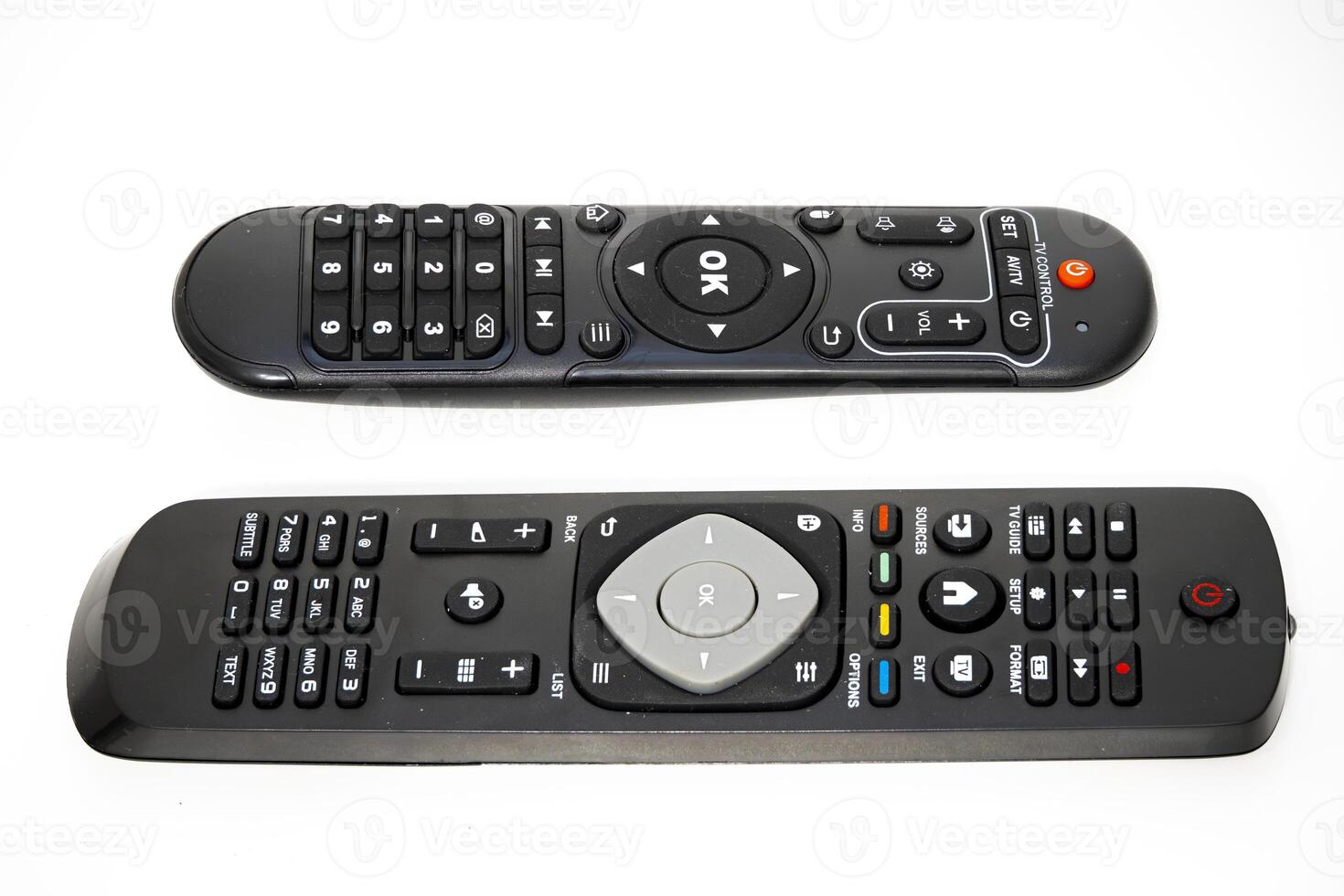 Two remote controls for televisions and devices on a white background photo