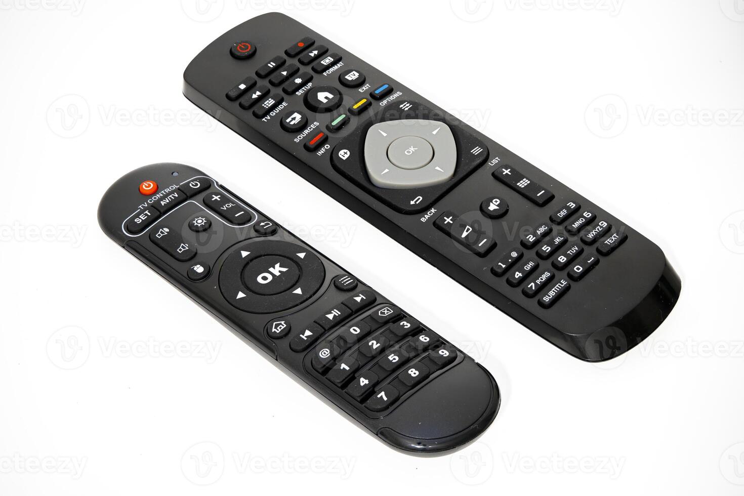 Comparison of two remote controls on a white background photo