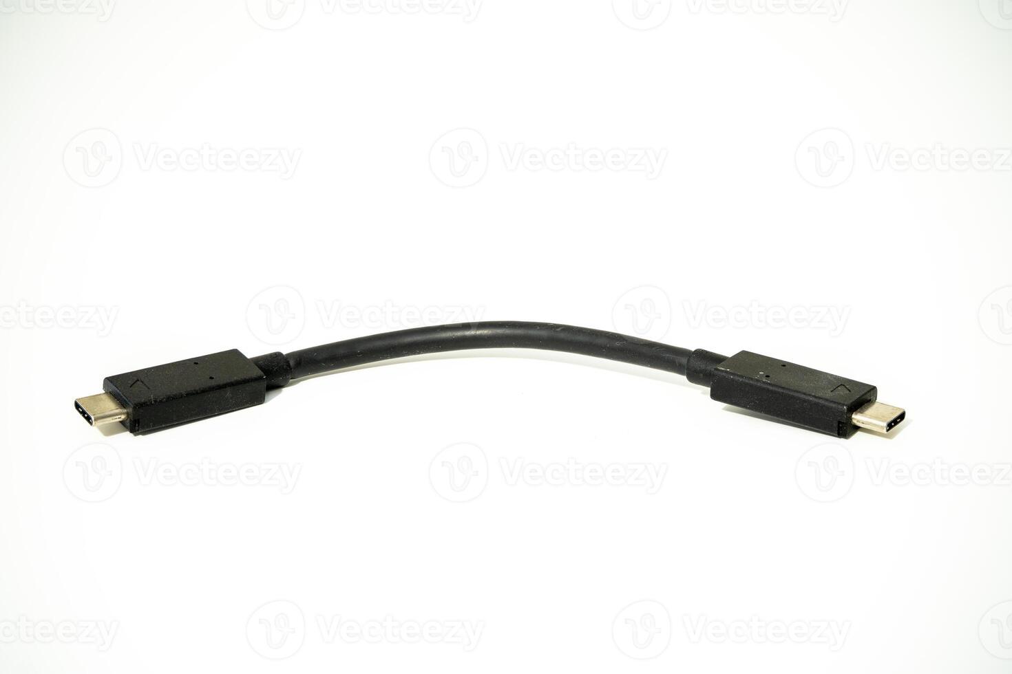 USB cable connecting devices in a tech workspace setup photo