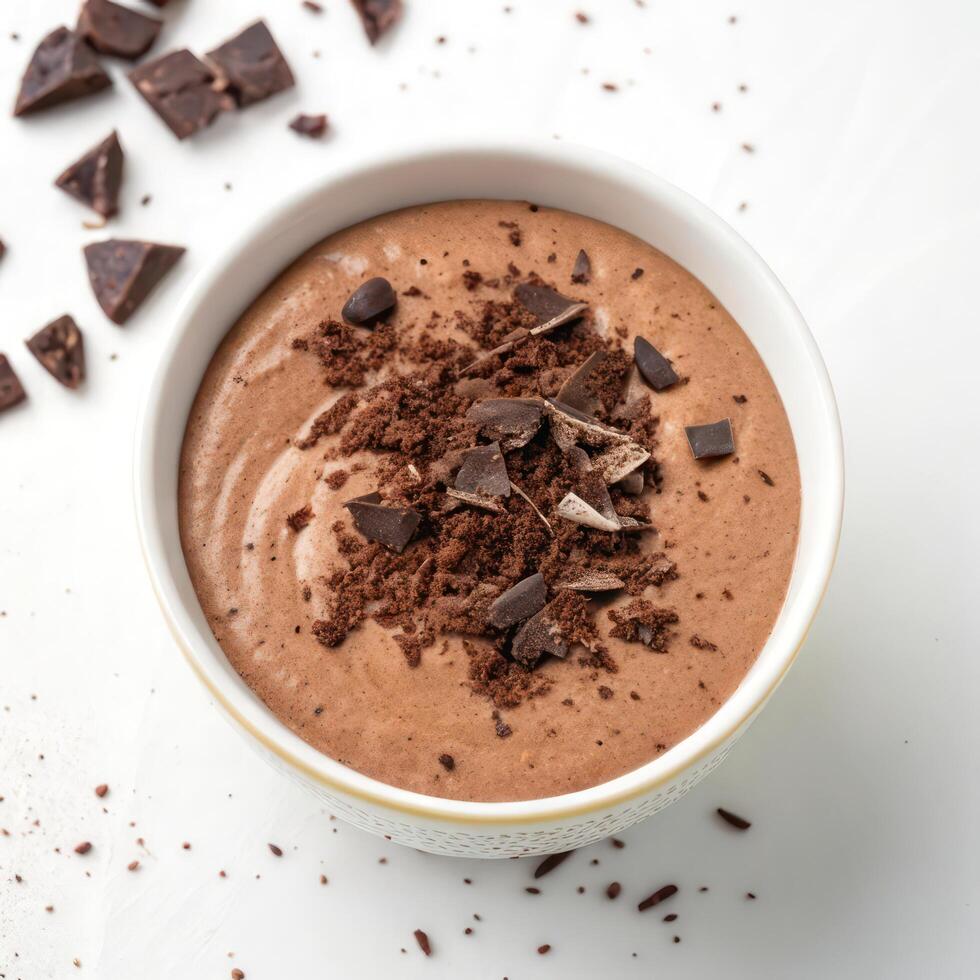 Top View of Chocolate Mousse with Shavings in a Bowl on a White Background photo