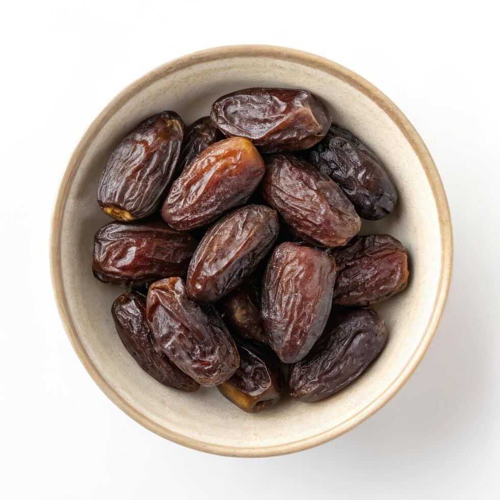 Top View of Dates in a Bowl on a White Background photo