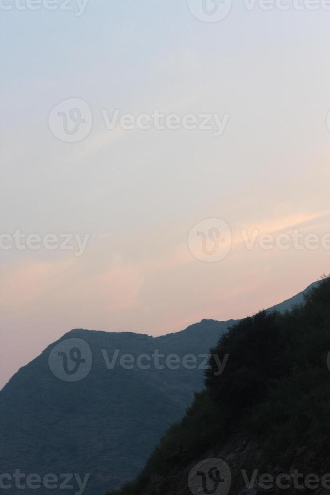 A person flying a kite in the sky photo