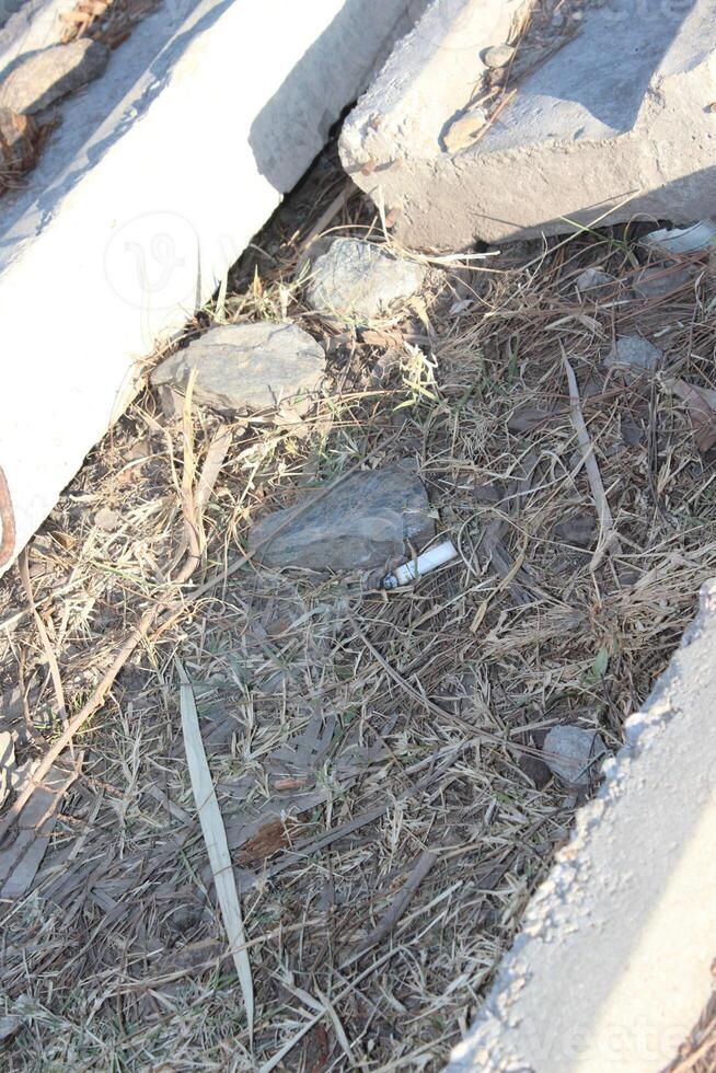 A broken down fire hydrant laying on the ground photo