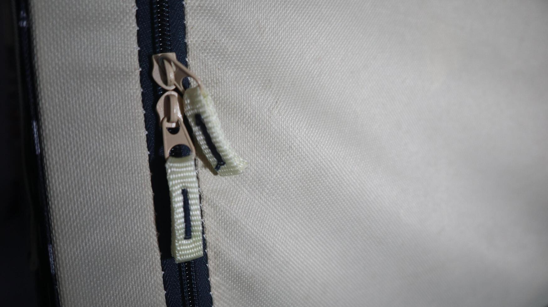 a photo of a zipper on a bag that has two