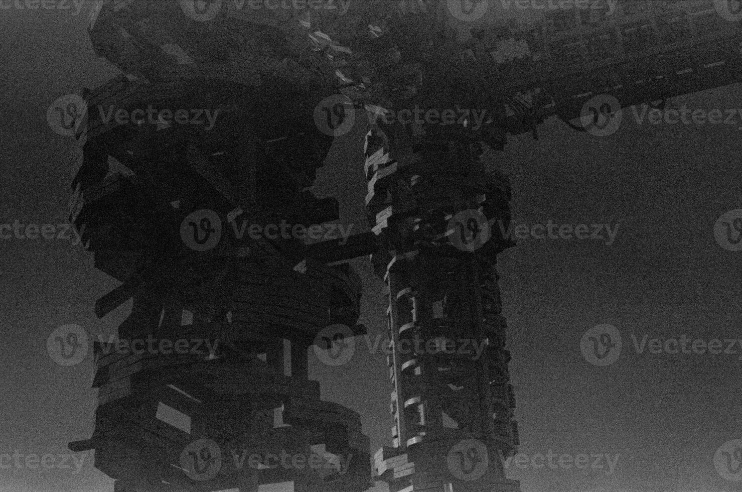 BW photo of a big machine in fog with urban design and dark theme