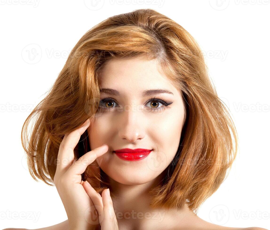 Beautiful young woman with red hair, close up photo