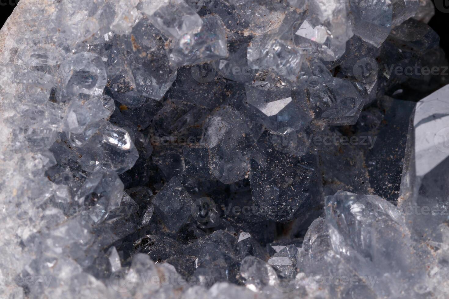 Celestine mineral stone macro on microcline on black background close up photo