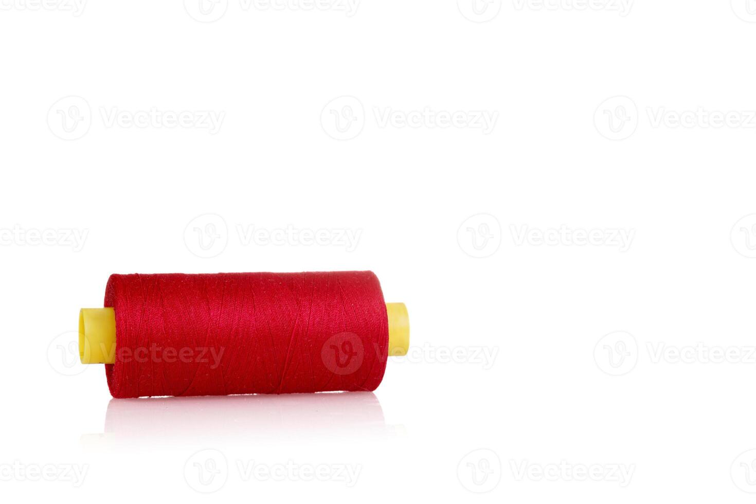 skein of thread red colors macro on a white background close up photo